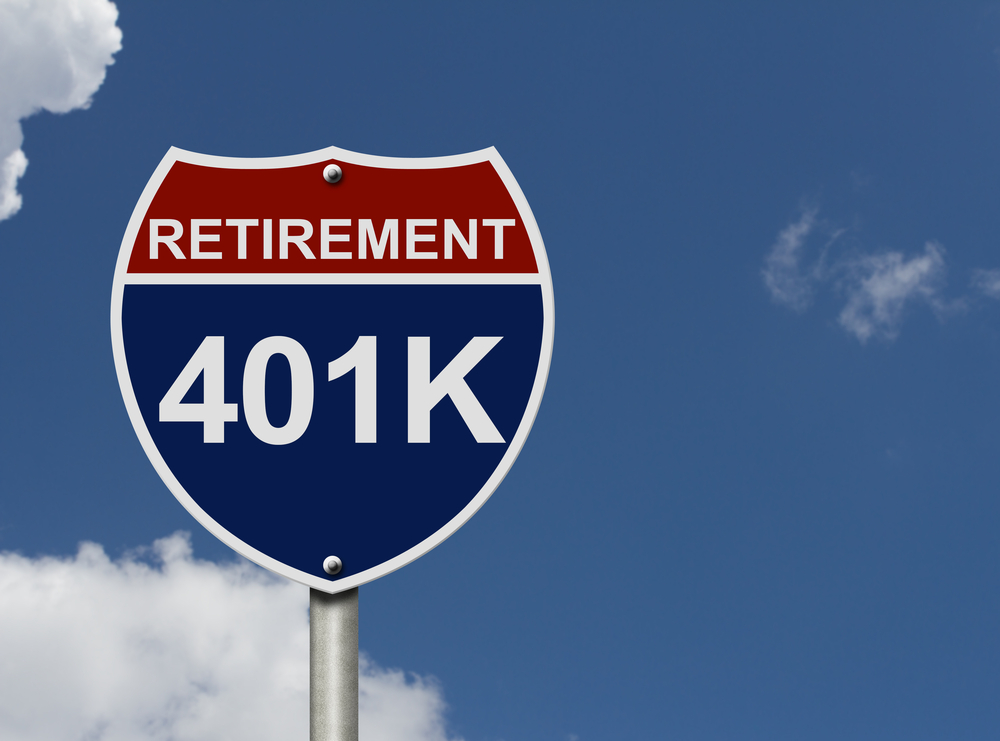 A U.S. interstate sign says “retirement” and “401k.”