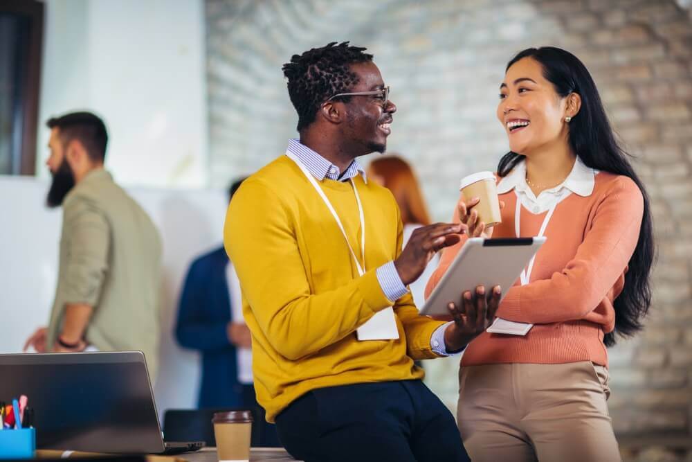 Employees talking and smiling